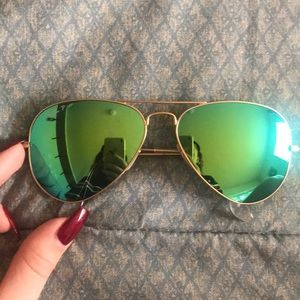 Green Ray Ban P sunglasses.